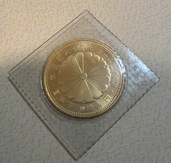 天皇御在位60年　10万円金貨